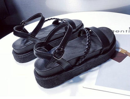 Pair of black platform sandals with open toe, double buckle ankle strap and braided strap on Tampa Home & Garden Store