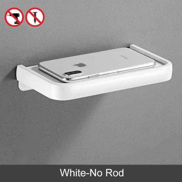 White wall-mounted toilet paper holder with built-in shelf and adhesive mount no rod on Tampa Home & Garden Store