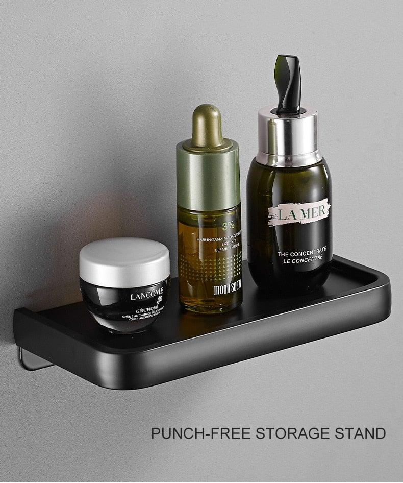 Matte black wall-mounted bathroom storage shelf with adhesive toilet paper holder on Tampa Home & Garden Store