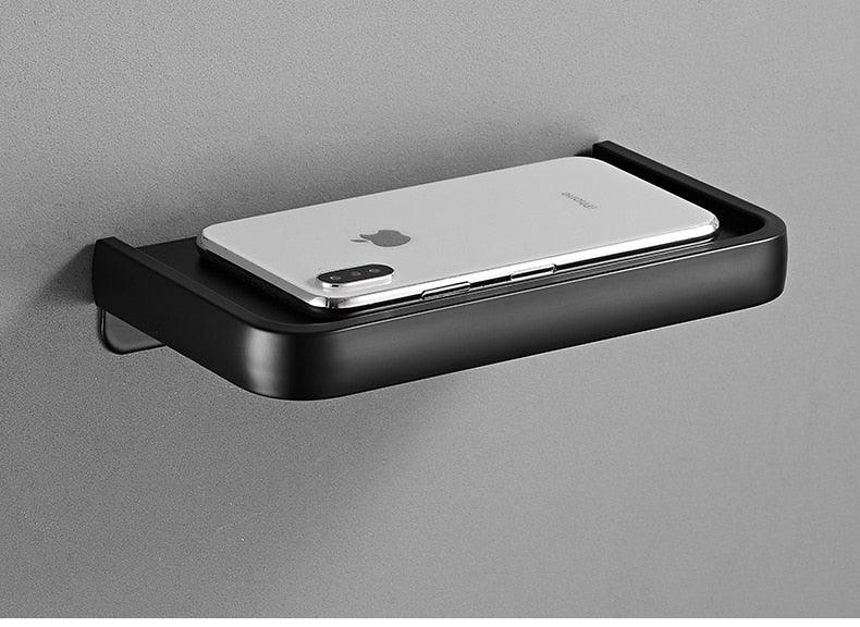 Stevvex matte black toilet paper holder with shelf, wall-mounted adhesive design on Tampa Home & Garden Store