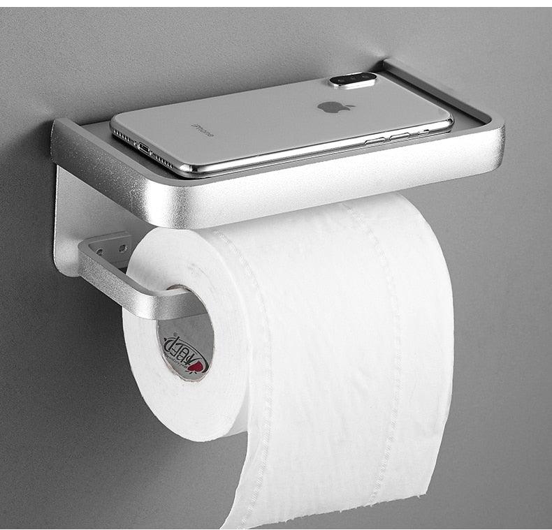 Toilet paper holder with shelf in silver finish holding a roll and a smartphone on Tampa Home & Garden Store