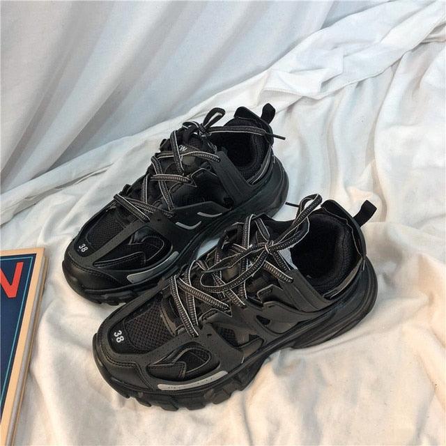 Pair of black women's breathable mesh sneakers with chunky outsole and lace-up design on Tampa Home & Garden Store