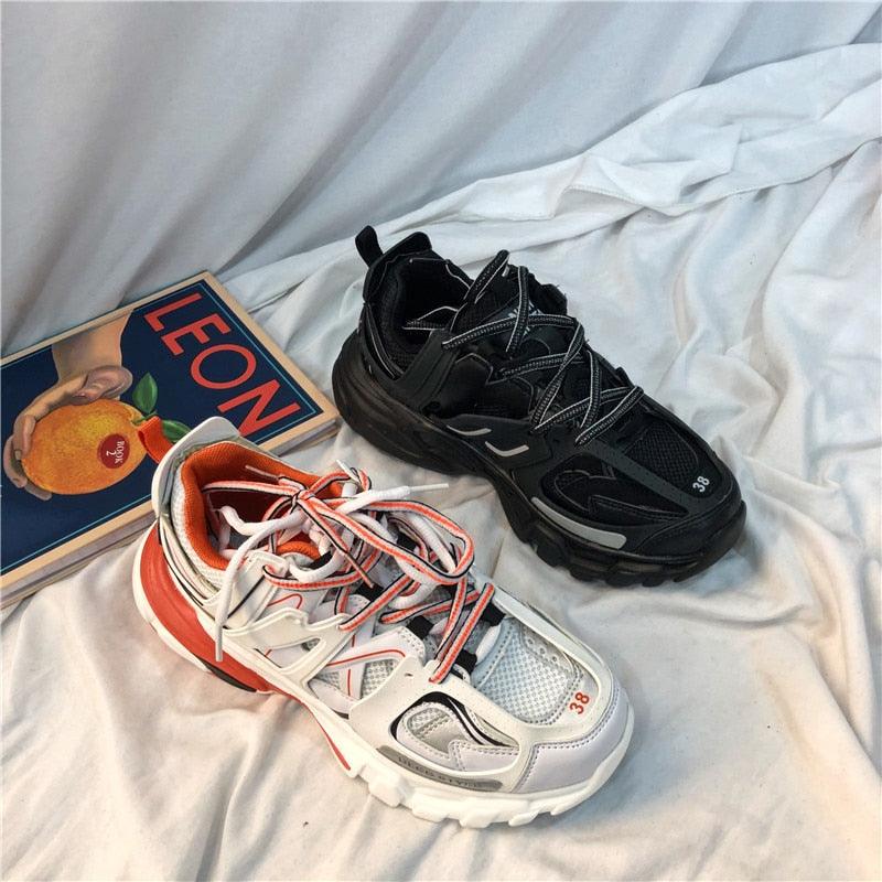 Stevvex black and white sneakers with mesh upper and cushioned sole, two sneakers on Tampa Home & Garden Store