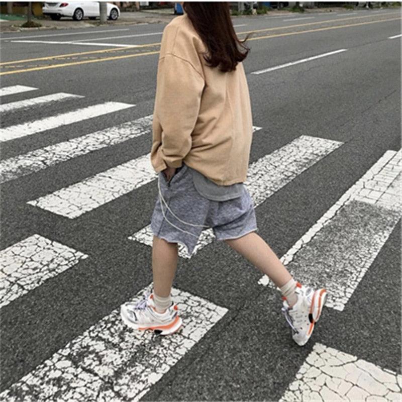 Stevvex women's white breathable mesh sneakers with orange accents for casual running on Tampa Home & Garden Store