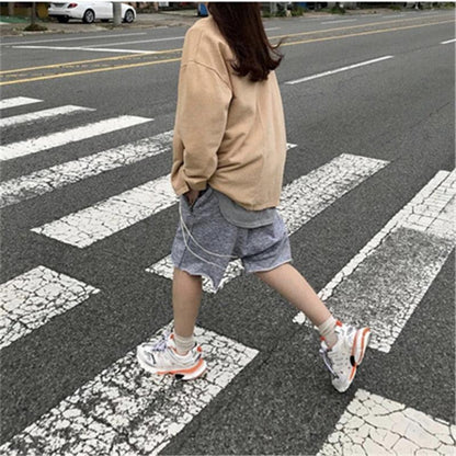 Stevvex women's white breathable mesh sneakers with orange accents for casual running on Tampa Home & Garden Store