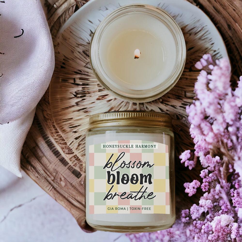 Honeysuckle Harmony Candle by Gia Roma in glass jar with pastel plaid label; lit wick on Tampa Home & Garden Store