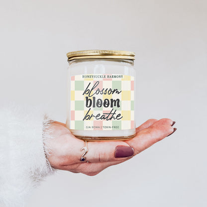 Honeysuckle Harmony Candle by Gia Roma in a clear glass jar with a gold lid and pastel plaid label on Tampa Home & Garden Store