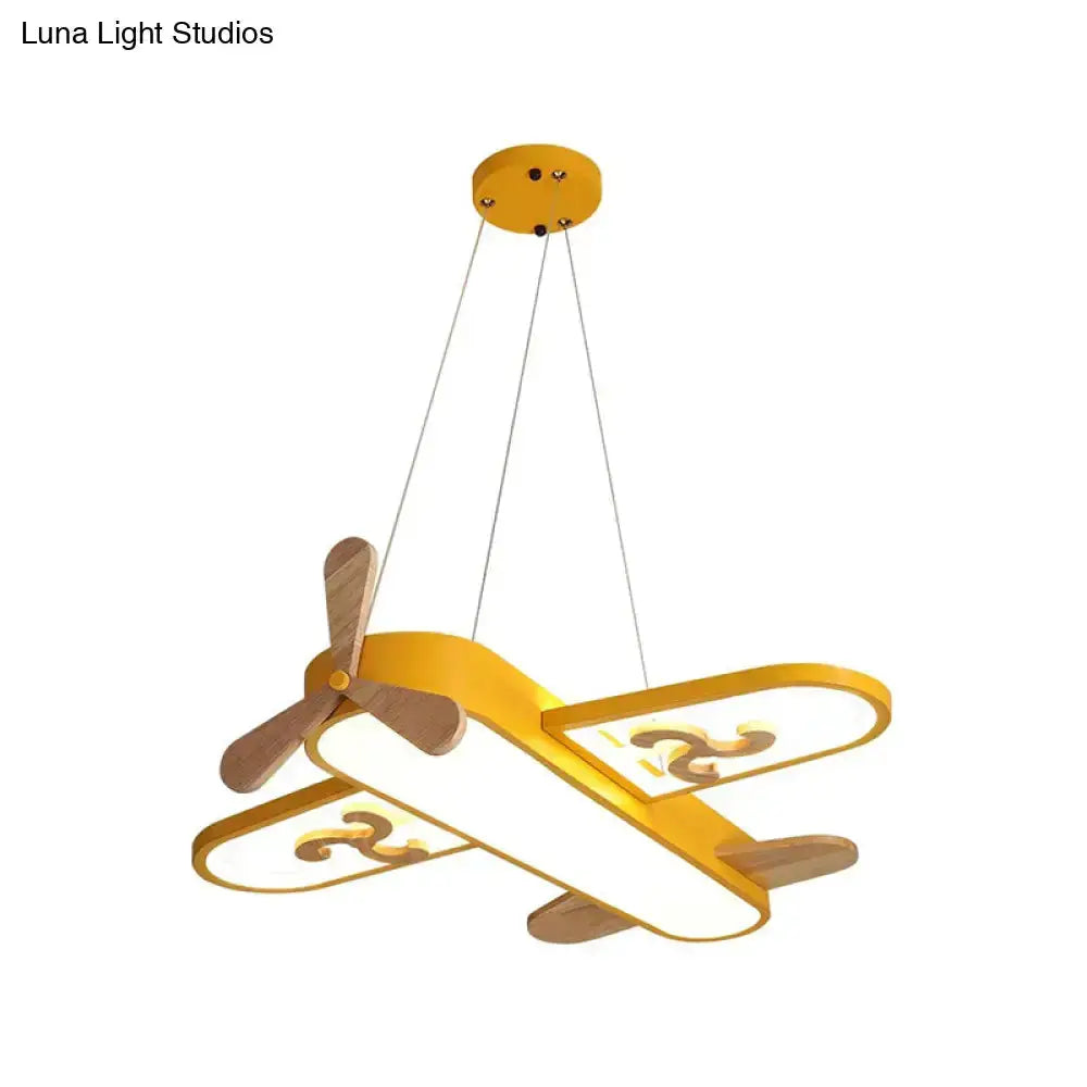 Airplane-shaped LED chandelier in yellow with wooden propellers by Decorbites for home lighting on Tampa Home & Garden Store