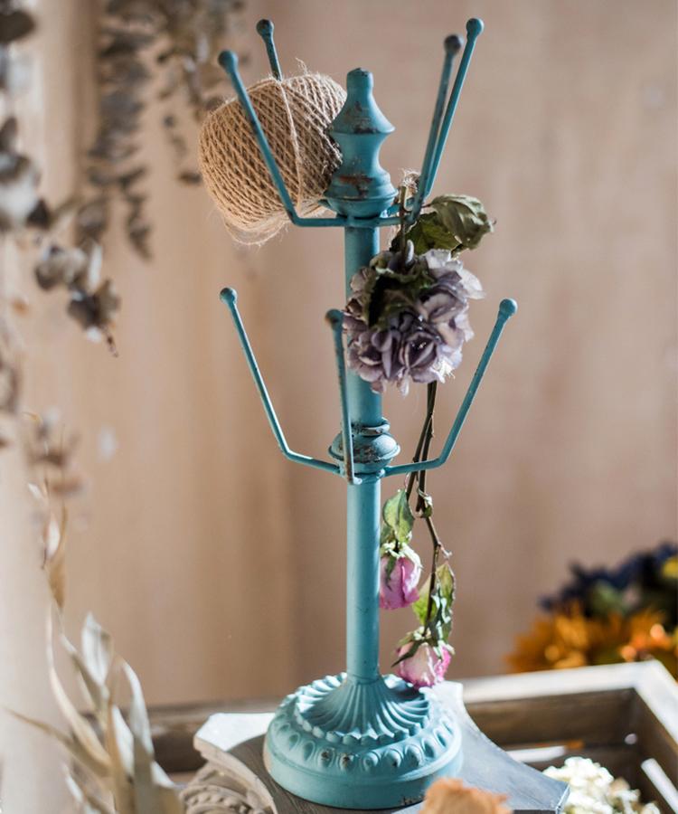 Blue steel cup holder planter stand by RusticReach with burlap ball and fabric flower accents on Tampa Home & Garden Store