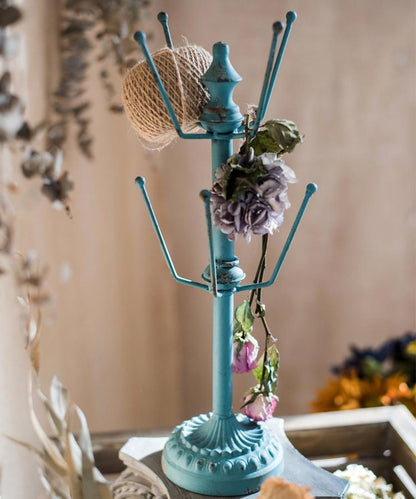 Blue steel cup holder planter stand by RusticReach with burlap ball and fabric flower accents on Tampa Home & Garden Store