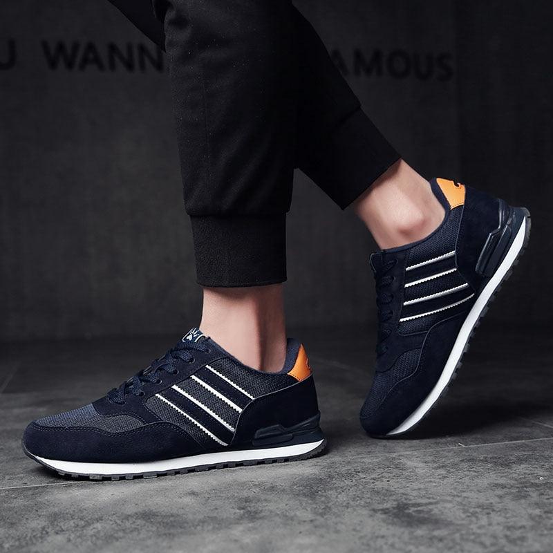 Stevvex blue men's casual sneakers with white stripes and orange heel patch, leather upper on Tampa Home & Garden Store