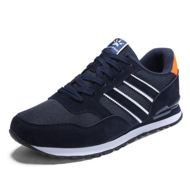Stevvex blue men's casual sneakers with white stripes and orange heel tab on Tampa Home & Garden Store