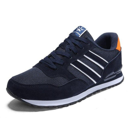 Stevvex blue men's casual sneakers with white stripes and orange heel tab on Tampa Home & Garden Store