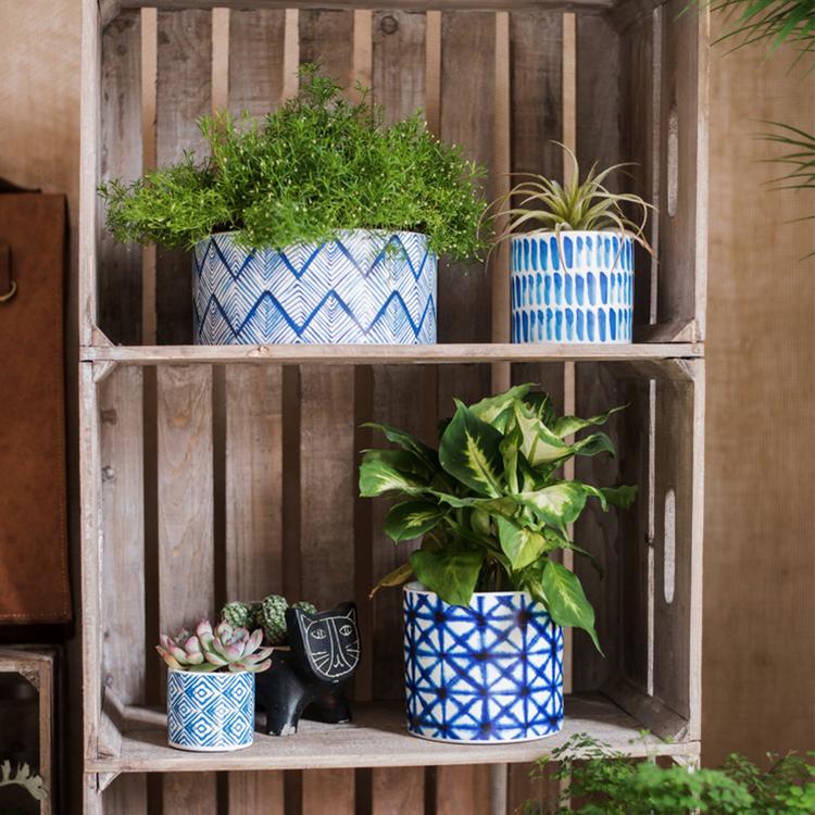 Blue Print ceramic vase planters 4-pack in blue/white geometric patterns on shelf RusticReach on Tampa Home & Garden Store