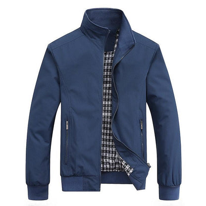 Men's navy blue lightweight windbreaker jacket with zip pockets and plaid lining on Tampa Home & Garden Store