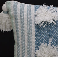 Throw pillow Vibhsa blue striped accent pillow 14x20 with large white pom-poms and tassels on Tampa Home & Garden Store