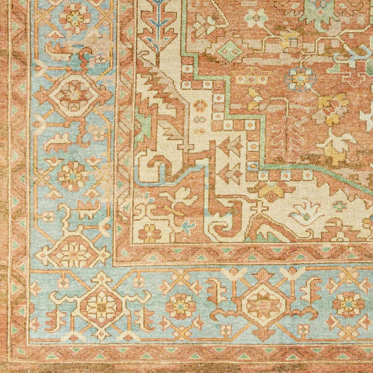 Bangonay Area Rug by Boutique Rugs in an oriental medallion design with coral pink and pale blue on Tampa Home & Garden Store