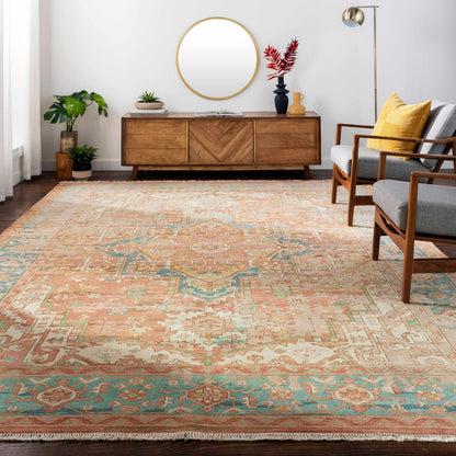 Bangonay area rug by Boutique Rugs in peach and aqua with geometric motif and fringed edge on Tampa Home & Garden Store