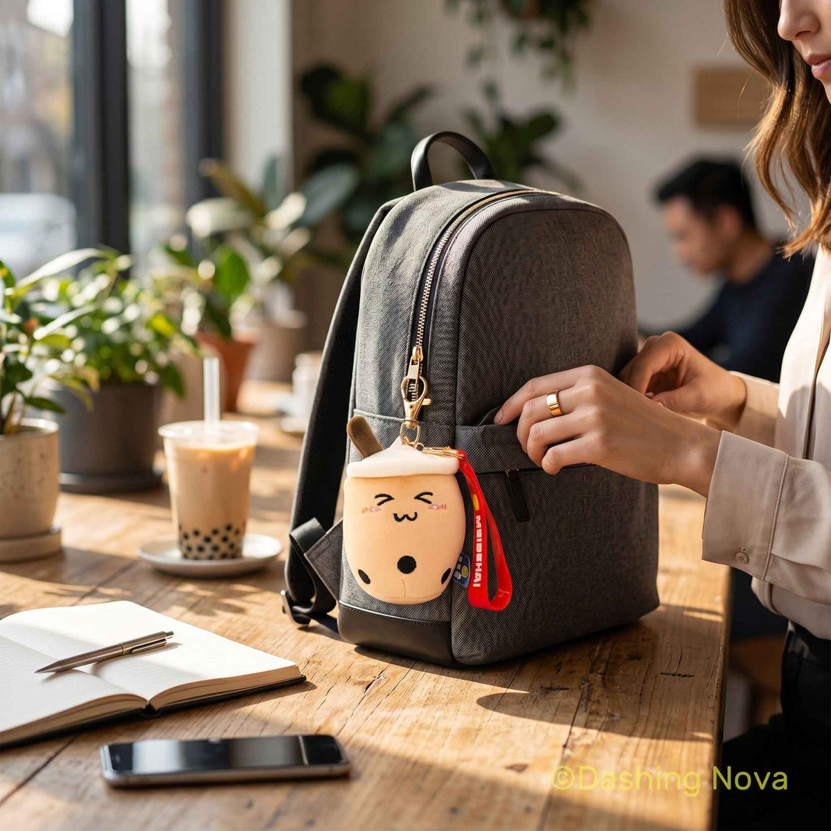 Boba keychain set 3-pack fabric bag charms by Shaketea attached to a gray backpack on Tampa Home & Garden Store