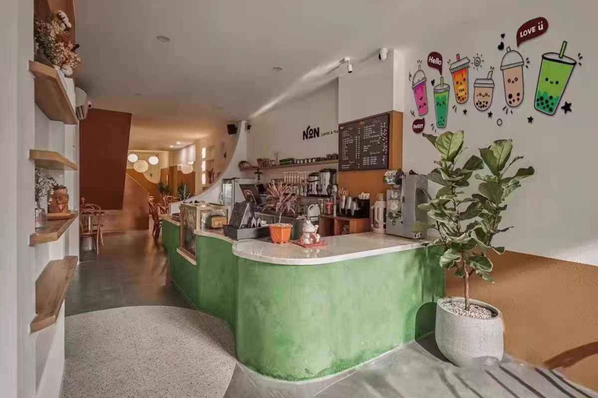 Boba Store Wall Decoration Shaketea vibrant wall art of bubble tea cups above a green counter on Tampa Home & Garden Store