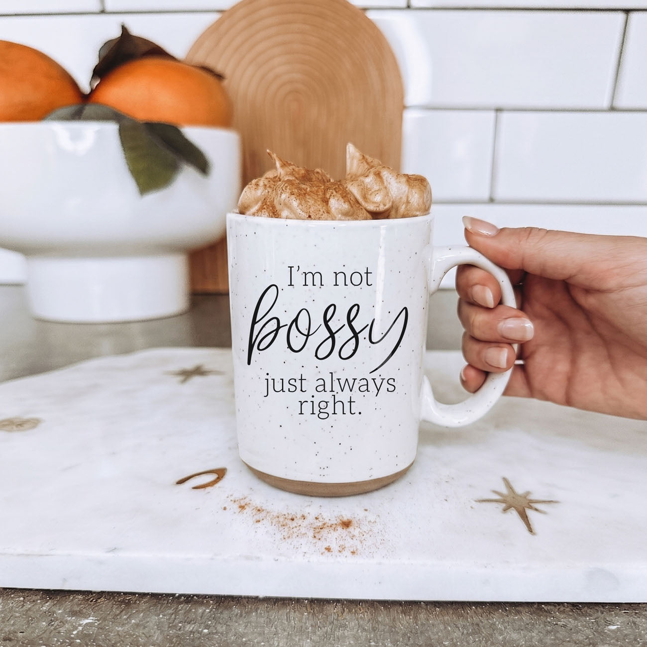 Bossy 16oz coffee mug by Gia Roma, speckled white ceramic with text, whipped cream topping on Tampa Home & Garden Store