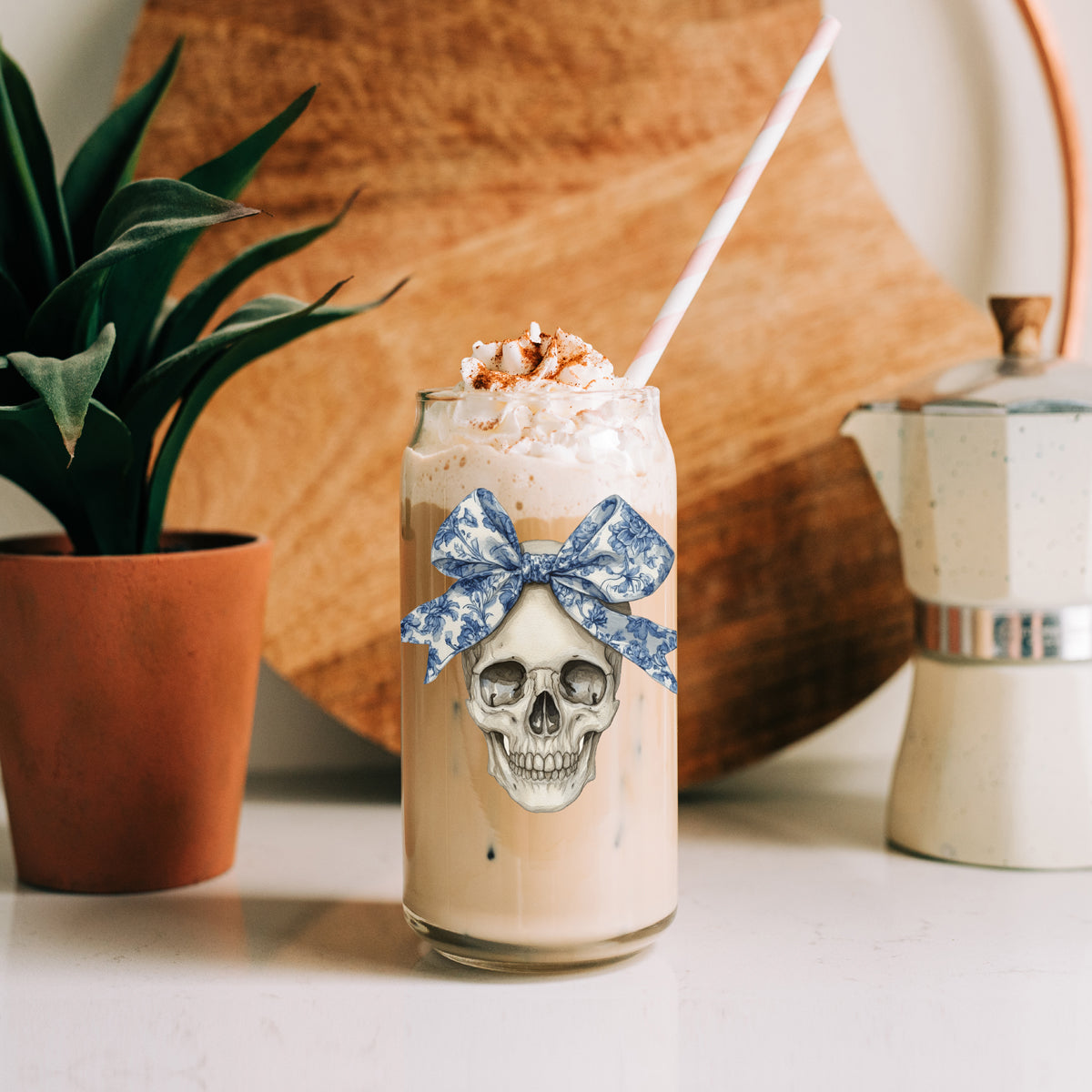 Bow Skull 20oz travel mug Gia Roma; skull with blue bow, beige latte, whipped cream, pink straw on Tampa Home & Garden Store
