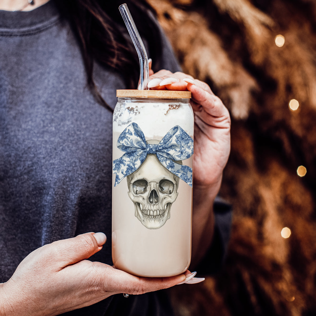 Gia Roma Bow Skull 20oz travel mug with beige body, blue patterned skull bow and clear straw on Tampa Home & Garden Store