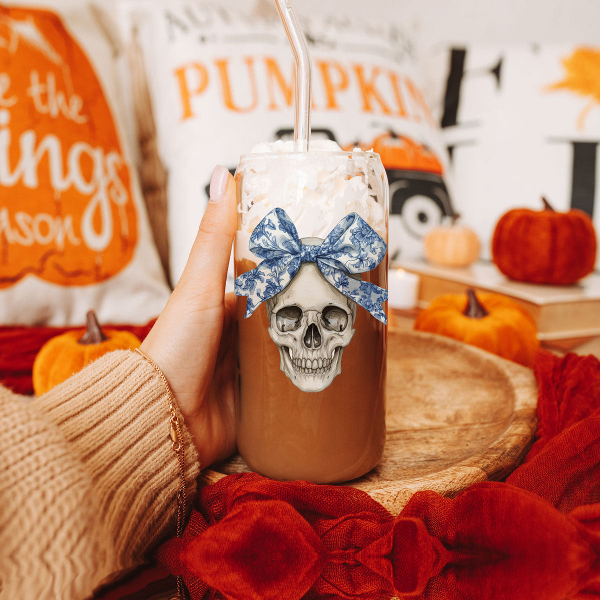 Bow Skull 20oz travel mug with skull and blue floral bow, brown drink topped with white flakes on Tampa Home & Garden Store