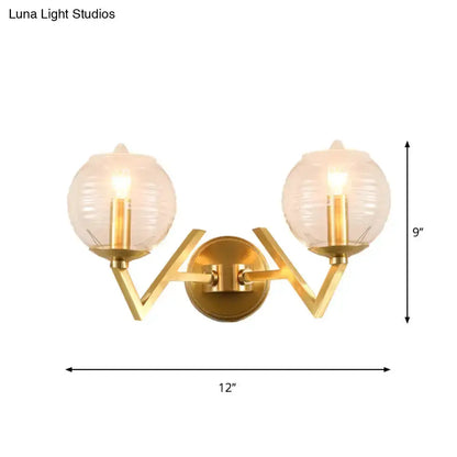 Brass ball sconce with ribbed glass shades, dual-arm gold wall light by Decorbites on Tampa Home & Garden Store