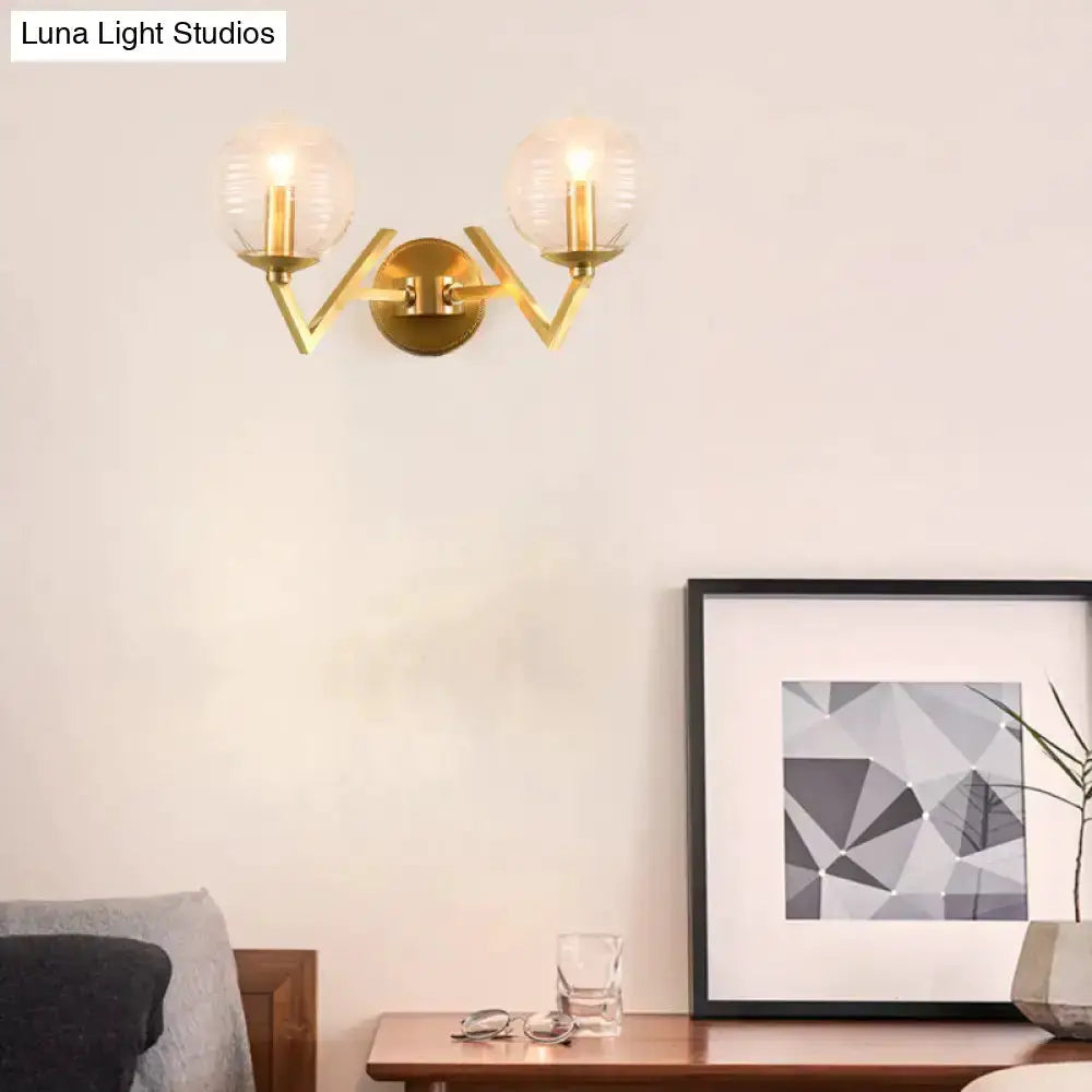 Brass ball sconce with ribbed glass shades by Decorbites for bedroom wall lighting on Tampa Home & Garden Store