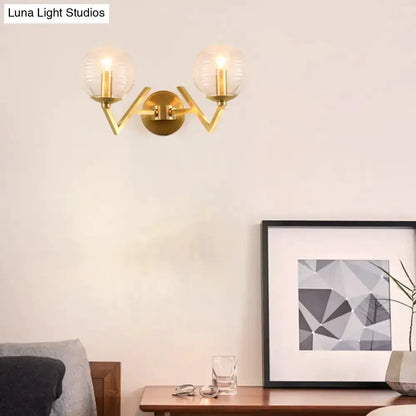 Brass ball sconce with ribbed glass shades by Decorbites for bedroom wall lighting on Tampa Home & Garden Store