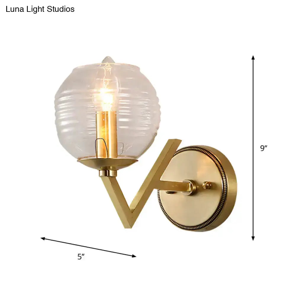 Brass ball sconce with ribbed glass shade for bedroom wall lighting 9in tall projection on Tampa Home & Garden Store
