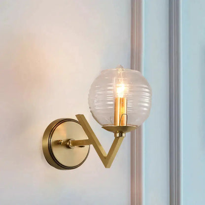 Brass ball sconce with ribbed glass shade for bedroom wall lighting Decorbites on Tampa Home & Garden Store