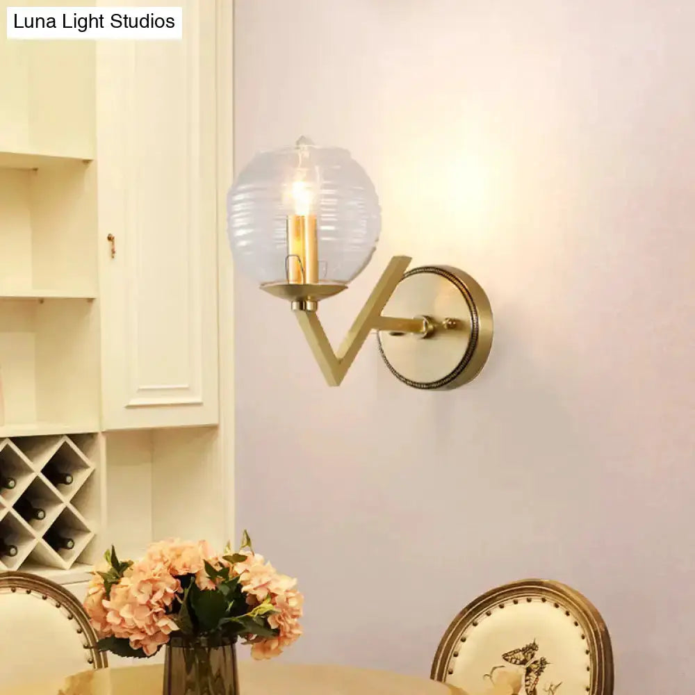 Brass ball sconce with ribbed glass globe shade, wall-mounted bedroom lighting Decorbites on Tampa Home & Garden Store