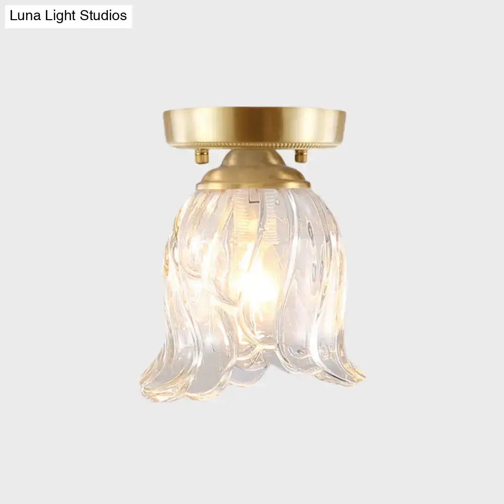 Brass glass flush mount light by Decorbites with clear ribbed petal shade on Tampa Home & Garden Store
