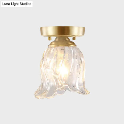 Brass glass flush mount light by Decorbites with clear ribbed petal shade on Tampa Home & Garden Store