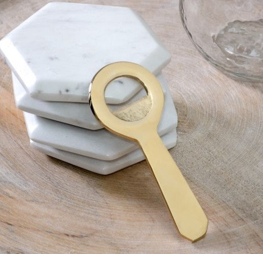 Brass bottle opener Thenestedfig with round ring head and flat handle on marble coasters on Tampa Home & Garden Store