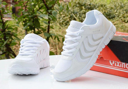 Stevvex white women's sneakers with breathable mesh upper, lace-up casual shoes; two on Tampa Home & Garden Store