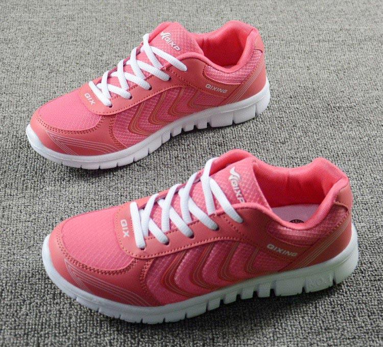 Stevvex pink breathable mesh sneakers for women with white laces and thick white sole, lace-up casual pair on carpet on Tampa Home & Garden Store