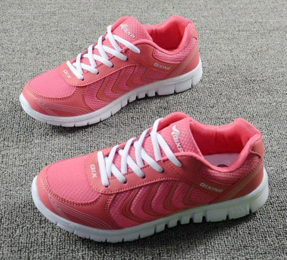 Stevvex pink breathable mesh sneakers for women with white laces and thick white sole, lace-up casual pair on carpet on Tampa Home & Garden Store
