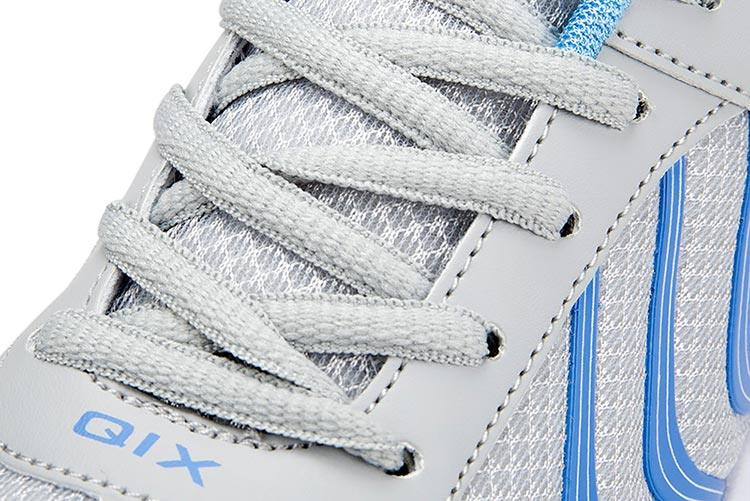 White QIX breathable mesh sneakers with gray overlays, lace-up athletic casual shoes on Tampa Home & Garden Store