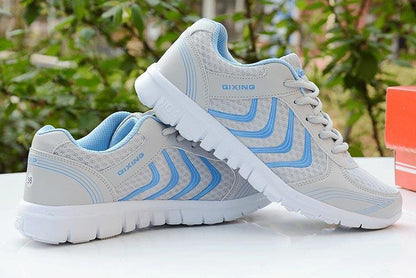 Breathable Stevvex sneakers with QIXING logo, white mesh pair lace-up casual athletic on Tampa Home & Garden Store