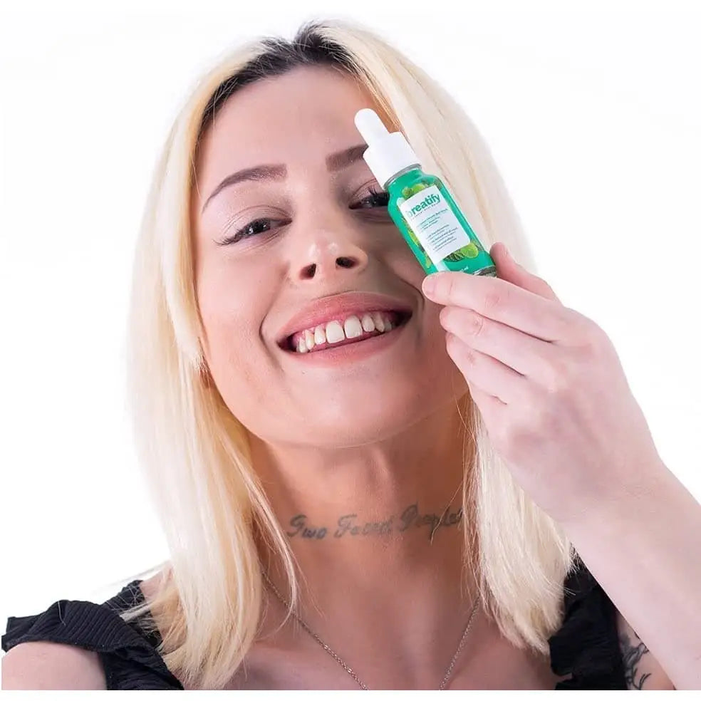 Breatify Bad Breath Serum breath spray in green bottle held by woman on Beauty Care Bag on Tampa Home & Garden Store