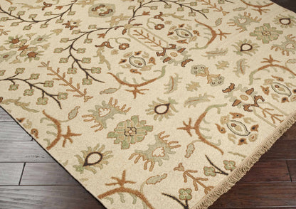 Brentford Carpet rug in beige with sage green and brown floral vine pattern, fringed edge on Tampa Home & Garden Store