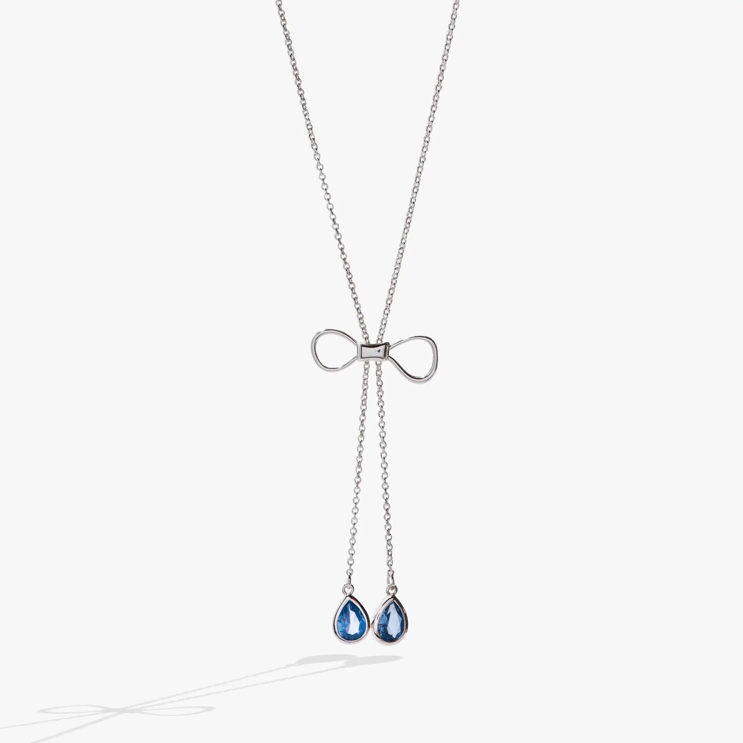 Bow Adjustable Slider Necklace with silver-tone chain and two blue teardrop gems on Tampa Home & Garden Store