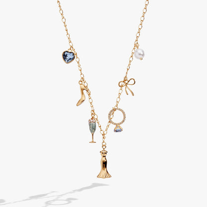 Bridal multi-charm necklace in gold with blue heart gemstone, pearl charm, champagne flute, bow on Tampa Home & Garden Store