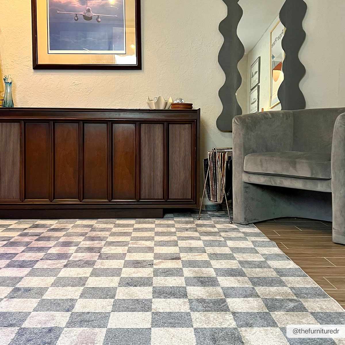 Brone Blue Checkered Washable Rug in a room with dark wood sideboard and gray velvet chair on Tampa Home & Garden Store