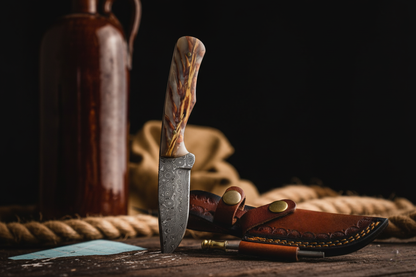 Barkspire TK-456 locking knife with damascus blade and marbled wood handle beside leather sheath on Tampa Home & Garden Store
