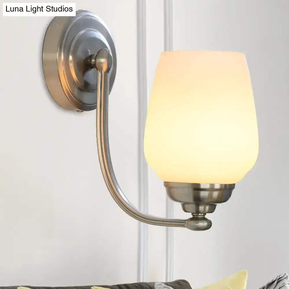 Nickel glass wall lamp with curved arm and frosted shade by Decorbites on Tampa Home & Garden Store