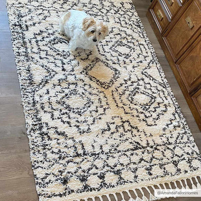 Buan Area Rug by Boutique Rugs, cream shag with black geometric pattern in home setting on Tampa Home & Garden Store